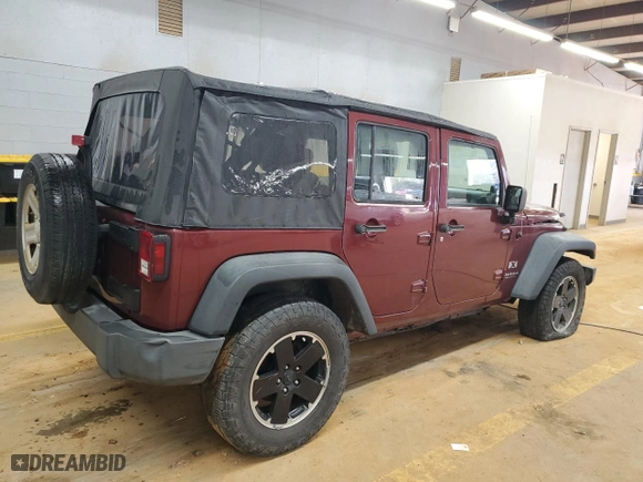 2009 Jeep Wrangler Unlimited X with VIN 1J4GA39149L704314, listed as a Copart auction lot 42699415 with 132,456 mi miles and Salvage Title. Bid and sale history available at carsss.com. Image 3.