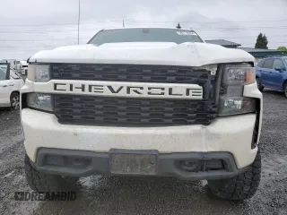 2019 Chevrolet Silverado 1500 Custom with VIN 3GCPYBEH7KG227329, listed as a Copart auction lot 50712934 with 99,428 mi miles and Salvage Title. Bid and sale history available at DreamBid. Image 5.