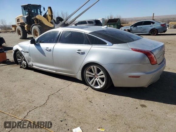 2014 Jaguar XJ Portfolio with VIN SAJWA2GZ2E8V70065, listed as a Copart auction lot 43872505 with 138,677 mi miles and Salvage title. Bid and sale history available at DreamBid. Image 2.