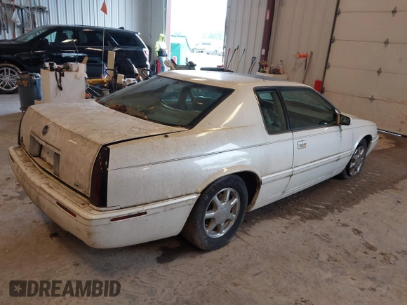 2001 Cadillac Eldorado Touring ETC z VIN 1G6ET12951B101641, wystawiony jako IAAI lot #42274235 z przebiegiem 119 965 mil mil oraz . Historia ofert i sprzedaży dostępna na DreamBid. Obrazek 4.
