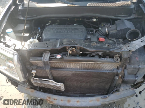 2011 Honda Pilot Touring z VIN 5FNYF4H92BB090512, wystawiony jako Copart lot #57046015 z przebiegiem 159 814 mil mil oraz Szkoda całkowita • Salvage title. Historia ofert i sprzedaży dostępna na DreamBid. Obrazek 12.