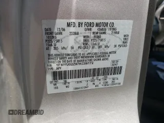 2007 Ford Escape XLS z VIN 1FMYU02Z97KC06172, wystawiony jako Copart lot #56978575 z przebiegiem 155 456 mil mil oraz Szkoda całkowita • Salvage title. Historia ofert i sprzedaży dostępna na DreamBid. Obrazek 13.