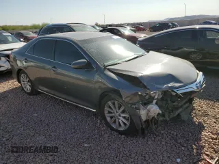 2012 Toyota Camry XLE z VIN 4T1BD1FK8CU048172, wystawiony jako Copart lot #51941205 z przebiegiem 186 001 mil mil oraz Szkoda całkowita • Salvage title. Historia ofert i sprzedaży dostępna na DreamBid. Obrazek 4.