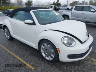 2013 Volkswagen Beetle 2.5L with VIN 3VW5P7AT9DM825439, listed as a IAAI auction lot 41760907 with 53,649 mi miles and . Bid and sale history available at DreamBid. Image 1.