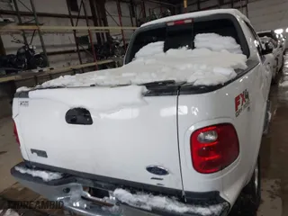 2001 Ford F-150 SuperCrew XLT with VIN 1FTRW08L41KF19093, listed as a IAAI auction lot 41419212 with 157,696 mi miles. Bid and sale history available at carsss.com. Image 16.
