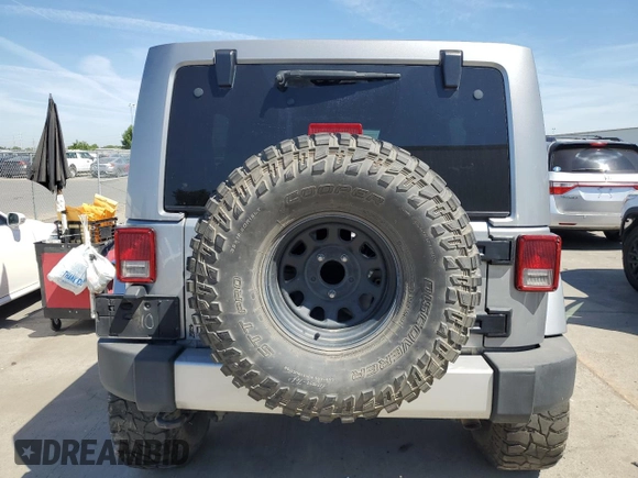 2013 Jeep Wrangler Unlimited Sahara with VIN 1C4BJWEG5DL662756, listed as a Copart auction lot 56423615 with 189,355 mi miles and Salvage title. Bid and sale history available at DreamBid. Image 6.