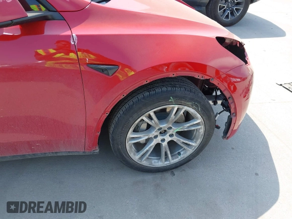 2023 Tesla Model Y Long Range z VIN 7SAYGAEE7PF691499, wystawiony jako IAAI lot #42038850 z przebiegiem 26 439 mil mil oraz . Historia ofert i sprzedaży dostępna na DreamBid. Obrazek 21.