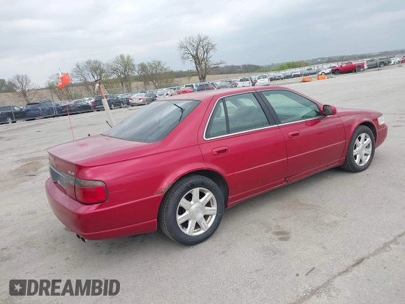 2001 Cadillac Seville z VIN 1G8KS54Y91U227846, wystawiony jako IAAI lot #42134095 z przebiegiem 216 766 mil mil oraz . Historia ofert i sprzedaży dostępna na DreamBid. Obrazek 4.
