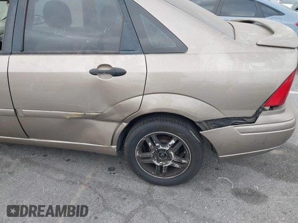 2003 Ford Focus SE z VIN 1FAFP34Z73W236474, wystawiony jako IAAI lot #39378102 z przebiegiem 183 280 mil mil oraz . Historia ofert i sprzedaży dostępna na DreamBid. Obrazek 6.