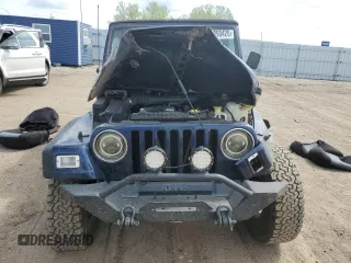 2002 Jeep Wrangler Sport z VIN 1J4FA49SX2P772609, wystawiony jako Copart lot #55893425 z przebiegiem 157 653 mil mil oraz Szkoda całkowita • Salvage title. Historia ofert i sprzedaży dostępna na DreamBid. Obrazek 5.