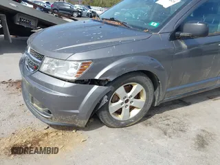 2013 Dodge Journey SE Plus with VIN 3C4PDCAB9DT582144, listed as a IAAI auction lot 41964828 with 171,398 mi miles and . Bid and sale history available at DreamBid. Image 6.
