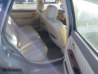 2003 Toyota Avalon XL with VIN 4T1BF28BX3U277269, listed as a IAAI auction lot 41589582 with 129,895 mi miles. Bid and sale history available at carsss.com. Image 8.