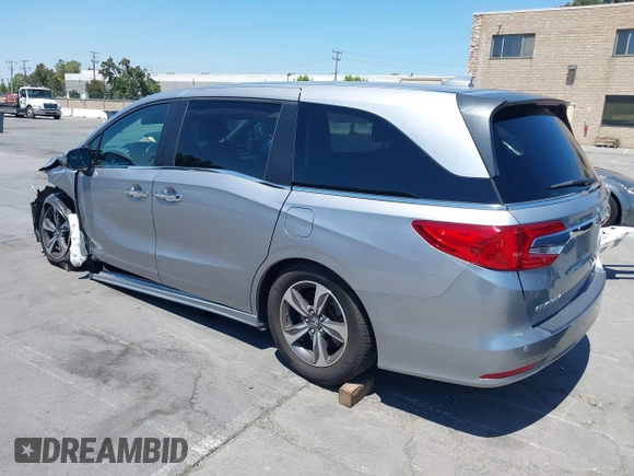 2018 Honda Odyssey Touring with VIN 5FNRL6H81JB022975, listed as a IAAI auction lot 42653304 with 210,137 mi miles and . Bid and sale history available at DreamBid. Image 3.