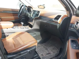 2015 Jeep Grand Cherokee Summit with VIN 1C4RJFJT1FC726330, listed as a IAAI auction lot 41781127 with 138,425 mi miles. Bid and sale history available at carsss.com. Image 5.