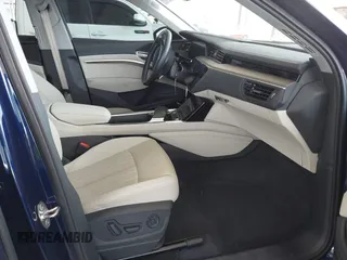 2021 Audi e-tron Premium Plus with VIN WA1LAAGE4MB038563, listed as a IAAI auction lot 42422063 with 31,645 mi miles and . Bid and sale history available at DreamBid. Image 5.