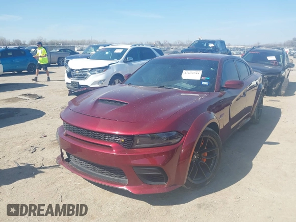 2022 Dodge Charger Scat Pack with VIN 2C3CDXGJ6NH216788, listed as a IAAI auction lot 41670744 with 48,680 mi miles and . Bid and sale history available at carsss.com. Image 2.