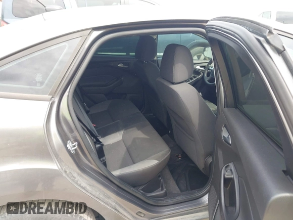 2013 Ford Focus SE z VIN 1FADP3F23DL159239, wystawiony jako IAAI lot #42076471 z przebiegiem 111 346 mil mil oraz . Historia ofert i sprzedaży dostępna na DreamBid. Obrazek 8.