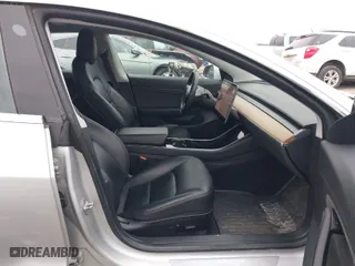 2018 Tesla Model 3 Long Range Battery with VIN 5YJ3E1EBXJF116906, listed as a IAAI auction lot 41913259 with 117,740 mi miles. Bid and sale history available at carsss.com. Image 5.