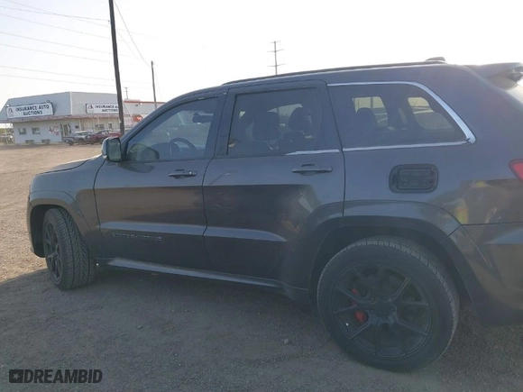 2015 Jeep Grand Cherokee SRT with VIN 1C4RJFDJ9FC842448, listed as a IAAI auction lot 41850385 with 178,439 mi miles. Bid and sale history available at carsss.com. Image 14.