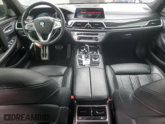 2019 BMW 7 Series 750i with VIN WBA7F0C54KGM25281, listed as a Copart auction lot 84741334 with 76,472 mi miles and Salvage Title. Bid and sale history available at carsss.com. Image 8.