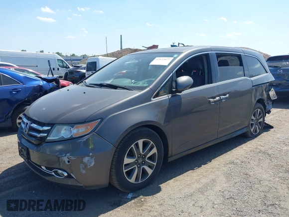 2014 Honda Odyssey Touring with VIN 5FNRL5H90EB082691, listed as a IAAI auction lot 42572977 with 54,413 mi miles and . Bid and sale history available at DreamBid. Image 17.