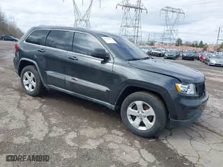 2011 Jeep Grand Cherokee Laredo with VIN 1J4RR4GG7BC721483, listed as a IAAI auction lot 41810180 with 181,558 mi miles. Bid and sale history available at carsss.com. Image 1.