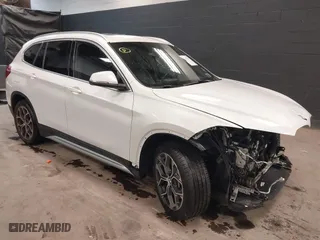 2021 BMW X1 xDrive28i with VIN WBXJG9C0XM5T76975, listed as a IAAI auction lot 41310115 with 26,869 mi miles. Bid and sale history available at carsss.com. Image 1.