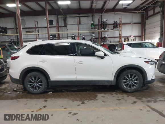 2020 Mazda CX-9 Touring z VIN JM3TCBCY8L0405360, wystawiony jako IAAI lot #41419428 z przebiegiem 69 917 mil mil oraz . Historia ofert i sprzedaży dostępna na DreamBid. Obrazek 13.