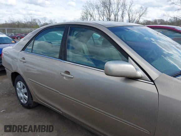 2003 Toyota Camry LE with VIN 4T1BE32KX3U123873, listed as a IAAI auction lot 42085492 with 166,901 mi miles and . Bid and sale history available at DreamBid. Image 13.