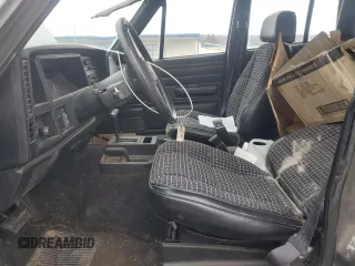 1987 Jeep Cherokee z VIN 1JCMR7819HT151523, wystawiony jako Copart lot #51586765 z przebiegiem 113 668 mil mil oraz Szkoda całkowita • Salvage title. Historia ofert i sprzedaży dostępna na DreamBid. Obrazek 7.