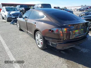2014 Tesla Model S 60 with VIN 5YJSA1H17EFP33275, listed as a IAAI auction lot 41778167 with 202,749 mi miles and . Bid and sale history available at DreamBid. Image 3.