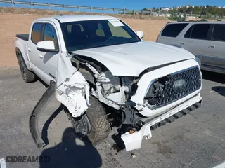 2019 Toyota Tacoma 4WD SR5 with VIN 3TMDZ5BN1KM079305, listed as a IAAI auction lot 41247804 with 98,494 mi miles. Bid and sale history available at carsss.com. Image 1.