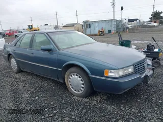 1993 Cadillac Seville Touring STS with VIN 1G6KY5290PU821230, listed as a IAAI auction lot 41778659 with 197,001 mi miles. Bid and sale history available at carsss.com. Image 1.
