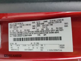 2018 Ford Escape SE z VIN 1FMCU9GD7JUB01668, wystawiony jako Copart lot #57038675 z przebiegiem 70 780 mil mil oraz Szkoda całkowita • Salvage title. Historia ofert i sprzedaży dostępna na DreamBid. Obrazek 14.