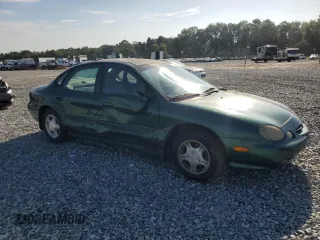 1999 Ford Taurus SE with VIN 1FAFP53U2XG184723, listed as a Copart auction lot 60787115 with 128,277 mi miles and Salvage title. Bid and sale history available at DreamBid. Image 4.
