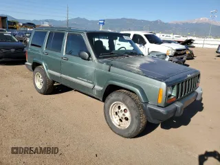 2000 Jeep Cherokee with VIN 1J4FF48S0YL198802, listed as a Copart auction lot 59996915 with 249,756 mi miles and Salvage title. Bid and sale history available at DreamBid. Image 4.