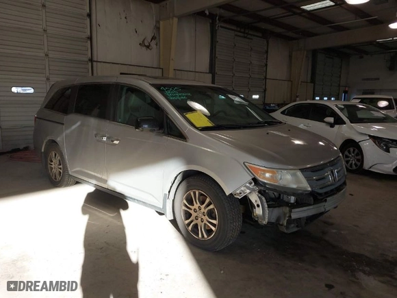 2012 Honda Odyssey EX-L with VIN 5FNRL5H61CB147311, listed as a IAAI auction lot 41607643 with 244,575 mi miles. Bid and sale history available at carsss.com. Image 1.