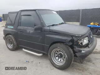 1994 Geo Tracker z VIN 2CNBE18U9R6936156, wystawiony jako Copart lot #45881915 z przebiegiem 201 227 mil mil oraz Szkody całkowita. Historia ofert i sprzedaży dostępna na DreamBid. Obrazek 4.