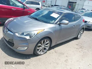 2012 Hyundai Veloster w/Black Int with VIN KMHTC6ADXCU061325, listed as a IAAI auction lot 42556398 with 122,954 mi miles and . Bid and sale history available at DreamBid. Image 2.