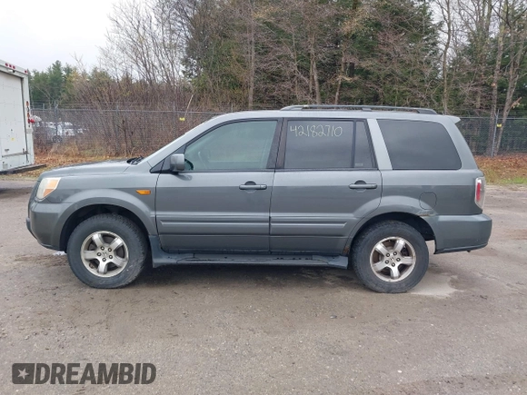 2007 Honda Pilot EX-L with VIN 2HKYF18667H526601, listed as a IAAI auction lot 42182710 with 221,948 mi miles and . Bid and sale history available at carsss.com. Image 12.