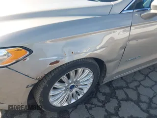 2015 Ford Fusion SE Hybrid with VIN 3FA6P0LUXFR133979, listed as a IAAI auction lot 41831288 with 143,738 mi miles. Bid and sale history available at carsss.com. Image 6.