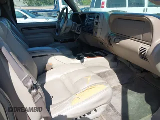 1999 Cadillac Escalade z VIN 1GYEK13R4XR419503, wystawiony jako IAAI lot #42215638 z przebiegiem 174 381 mil mil oraz . Historia ofert i sprzedaży dostępna na DreamBid. Obrazek 5.