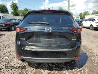2018 Mazda CX-5 Grand Touring with VIN JM3KFBDM6J0345848, listed as a Copart auction lot 61587865 with 107,193 mi miles and Salvage title. Bid and sale history available at DreamBid. Image 6.