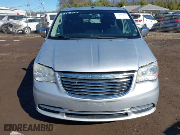 2011 Chrysler Town & Country Limited z VIN 2A4RR6DG1BR609818, wystawiony jako IAAI lot #41817330 z przebiegiem 160 482 mil mil oraz . Historia ofert i sprzedaży dostępna na DreamBid. Obrazek 13.
