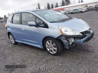 2009 Honda Fit Sport w/Navi with VIN JHMGE886X9S042490, listed as a IAAI auction lot 41931712 with 111,088 mi miles. Bid and sale history available at carsss.com. Image 1.