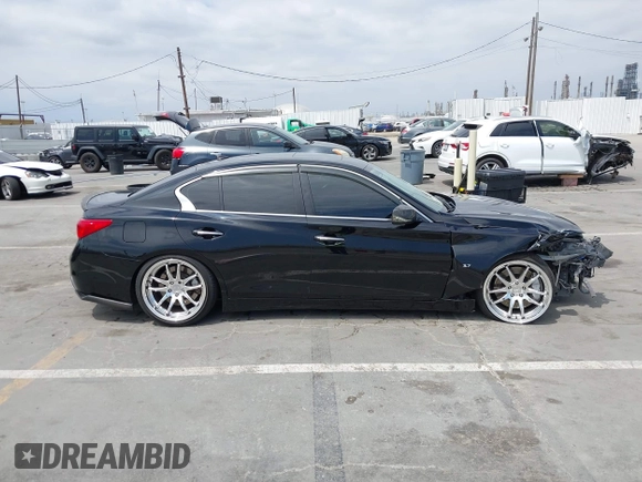 2014 Infiniti Q50 Premium z VIN JN1BV7AP3EM690571, wystawiony jako IAAI lot #42136354 z przebiegiem 191 969 mil mil oraz . Historia ofert i sprzedaży dostępna na DreamBid. Obrazek 13.