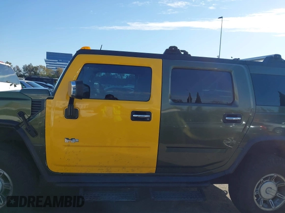 2003 Hummer H2 z VIN 5GRGN23UX3H124727, wystawiony jako IAAI lot #41697787 z przebiegiem 241 554 mil mil oraz . Historia ofert i sprzedaży dostępna na DreamBid. Obrazek 14.