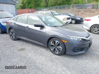 2018 Honda Civic EX-L z VIN JHMFC1F76JX025214, wystawiony jako IAAI lot #42078663 z przebiegiem 63 809 mil mil oraz . Historia ofert i sprzedaży dostępna na DreamBid. Obrazek 1.
