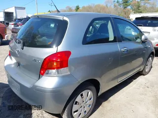 2009 Toyota Yaris with VIN JTDJT903495263456, listed as a IAAI auction lot 42135019 with 219,704 mi miles. Bid and sale history available at carsss.com. Image 4.