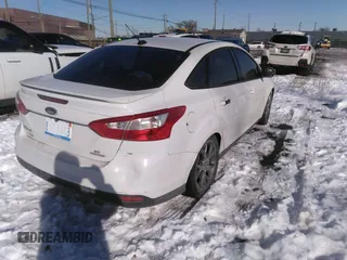 2013 Ford Focus SE z VIN 1FADP3F23DL337201, wystawiony jako IAAI lot #41630163 z przebiegiem 163 979 mil mil oraz . Historia ofert i sprzedaży dostępna na DreamBid. Obrazek 4.